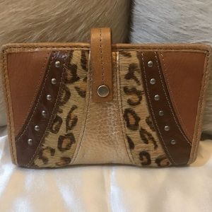 Fossil wallet with cowhide and studs
